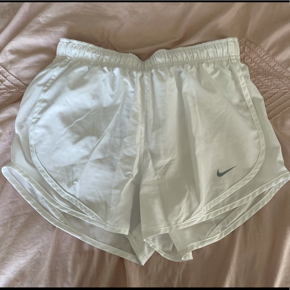 White Nike running shorts